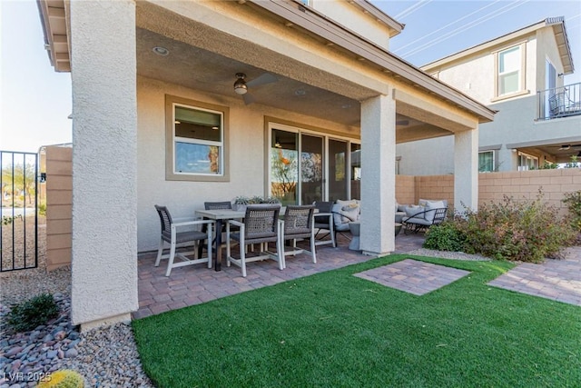 view of patio with outdoor lounge area and ceiling fan