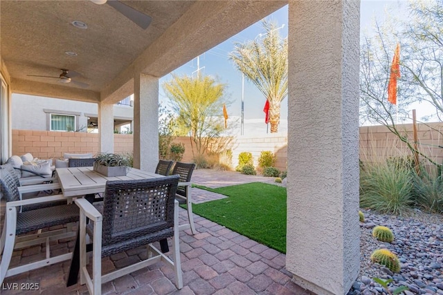 view of patio / terrace featuring ceiling fan