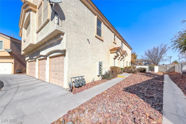 view of side of home with a garage