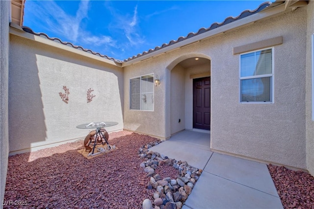 entrance to property with a patio