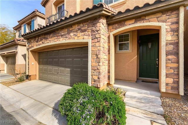 doorway to property with a garage