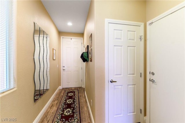 corridor featuring hardwood / wood-style flooring