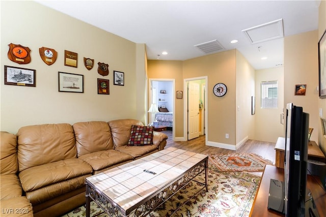 living room with light hardwood / wood-style flooring