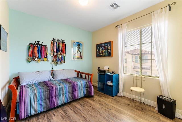 bedroom featuring wood-type flooring