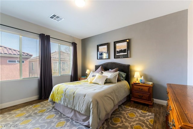 bedroom featuring dark hardwood / wood-style flooring