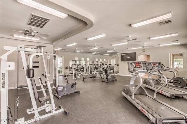 exercise room with ceiling fan