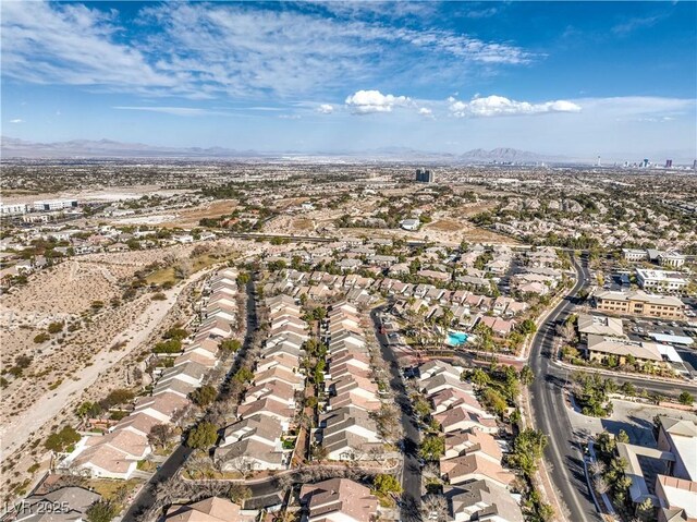 birds eye view of property with a mountain view