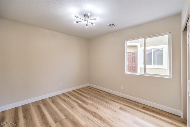 empty room with light wood-type flooring