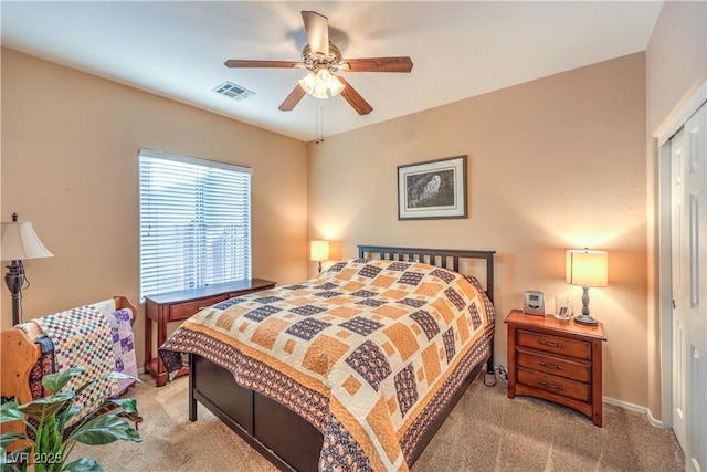 bedroom with light colored carpet and ceiling fan