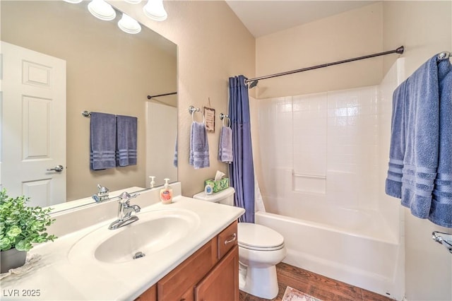 full bathroom with hardwood / wood-style flooring, vanity, toilet, and shower / bath combination with curtain