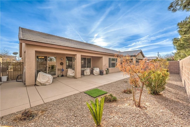 back of house featuring a patio area