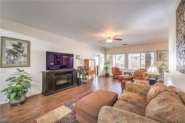 living room featuring hardwood / wood-style flooring and ceiling fan