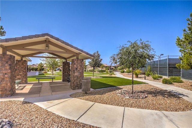 view of home's community with a yard and a gazebo