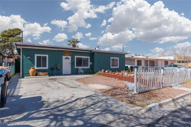 single story home with fence