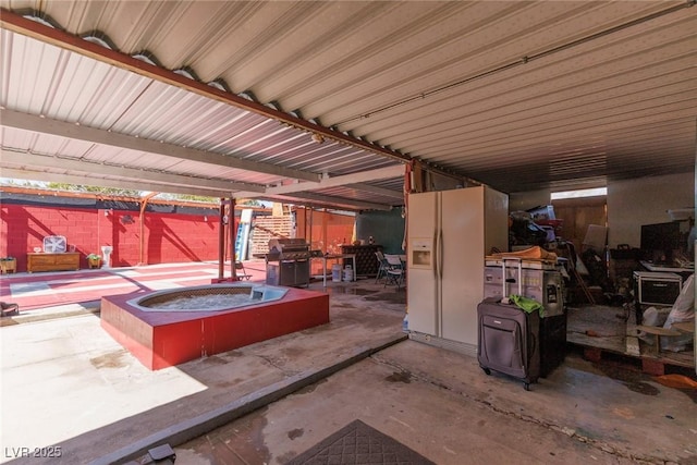 view of patio featuring a fire pit, fence, and grilling area