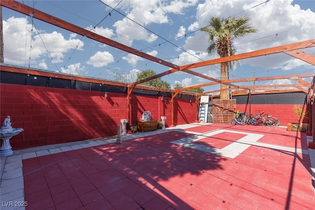 view of patio / terrace featuring fence