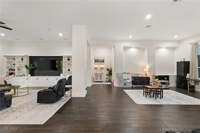 living room with dark hardwood / wood-style flooring