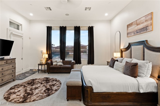 bedroom featuring light carpet