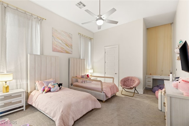 bedroom with light colored carpet and ceiling fan