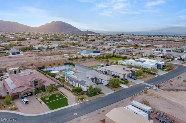 birds eye view of property featuring a mountain view