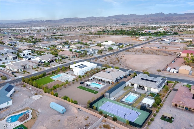 birds eye view of property with a mountain view