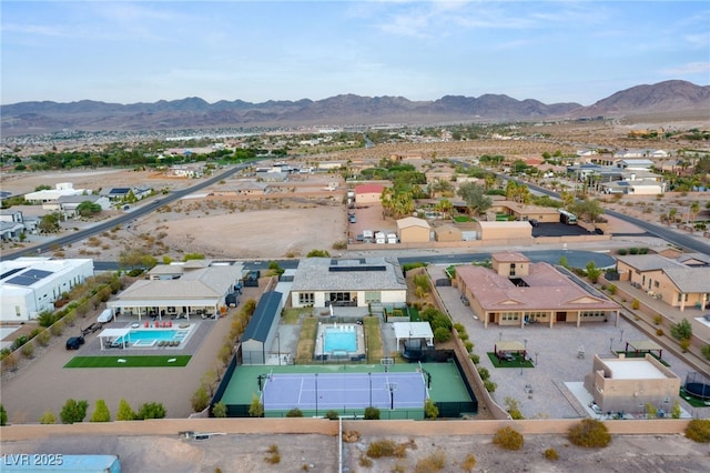 birds eye view of property featuring a mountain view