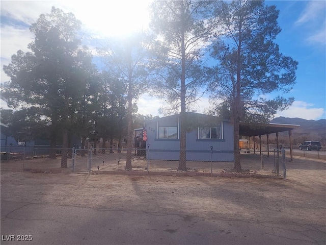 view of front of home featuring a carport and a mountain view