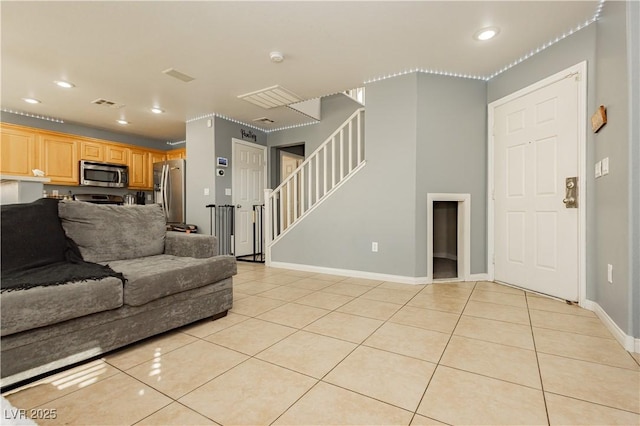 living area featuring light tile patterned floors, visible vents, stairway, and recessed lighting