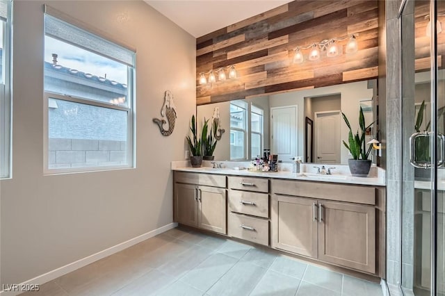 bathroom with vanity, a shower with shower door, tile patterned floors, and wood walls