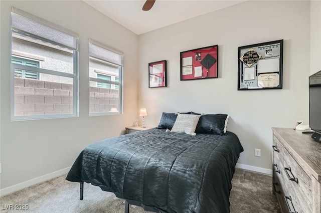 bedroom featuring ceiling fan and dark colored carpet