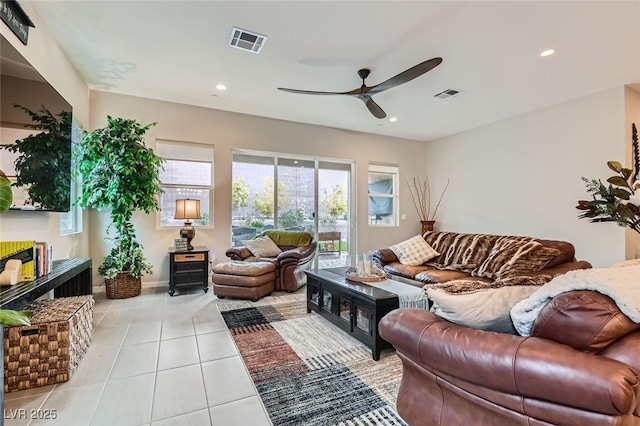 tiled living room with ceiling fan