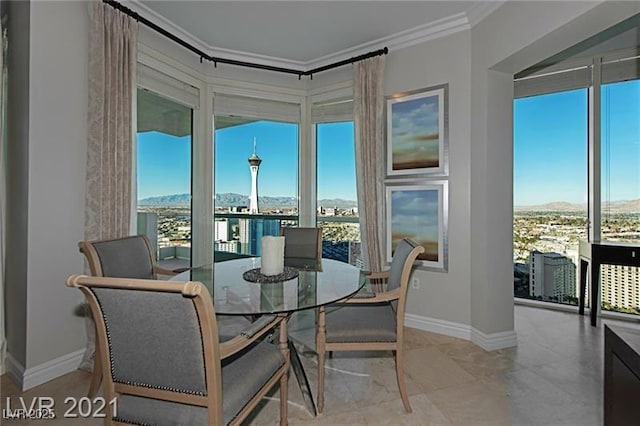 dining room featuring crown molding