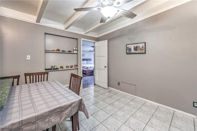 dining space with ceiling fan, light tile patterned floors, and beam ceiling