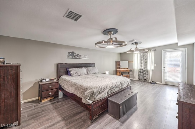 bedroom featuring hardwood / wood-style flooring, access to outside, and ceiling fan