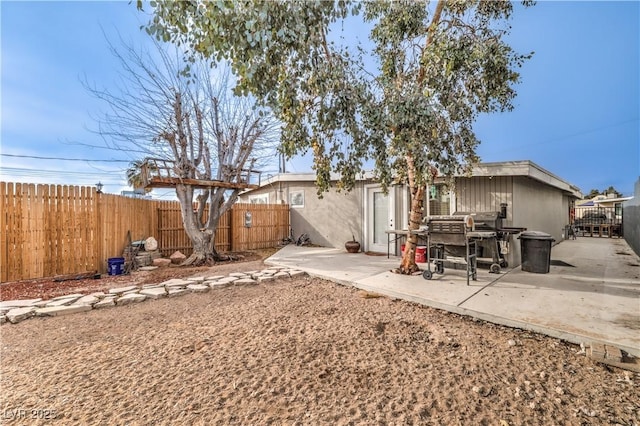 back of property featuring a patio area