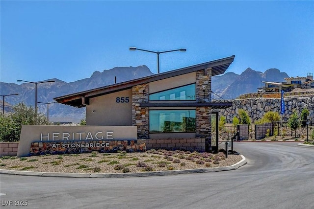 view of building exterior featuring a mountain view