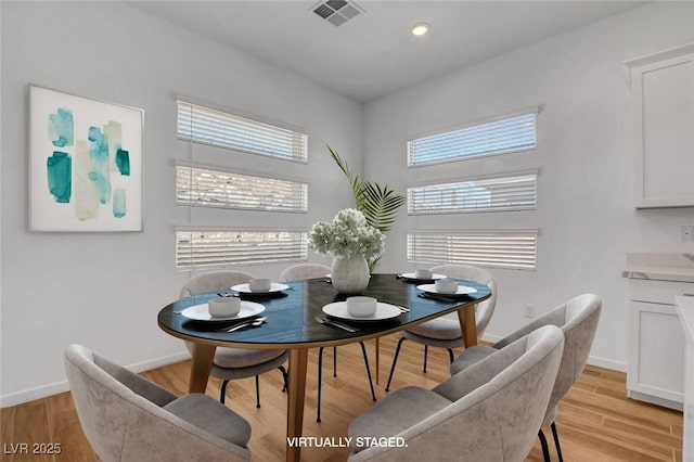 dining space featuring light hardwood / wood-style flooring