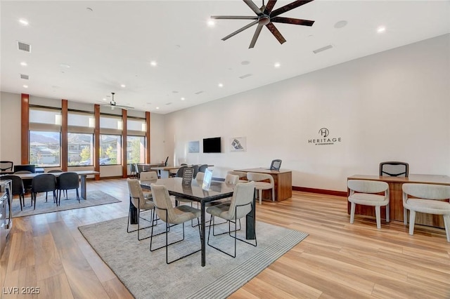 dining area featuring ceiling fan and light wood-type flooring