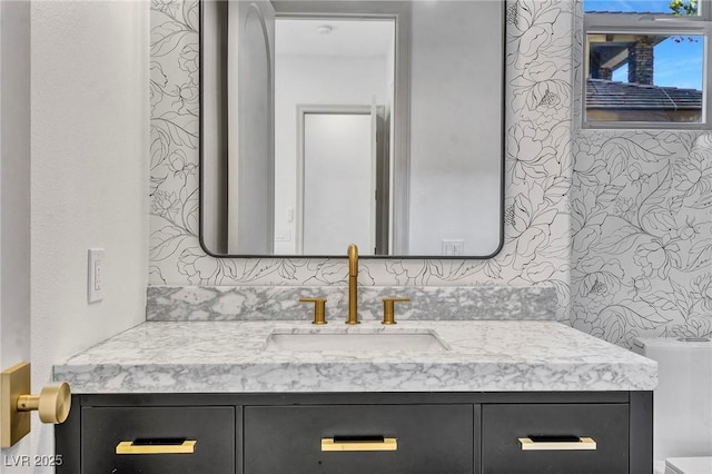 bathroom with toilet and vanity