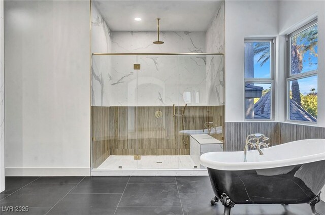 bathroom with tile patterned flooring, shower with separate bathtub, and a healthy amount of sunlight