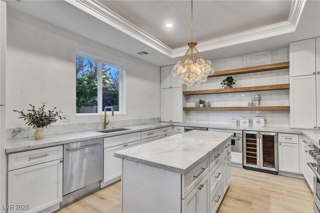 kitchen with white cabinetry, dishwasher, sink, beverage cooler, and a raised ceiling