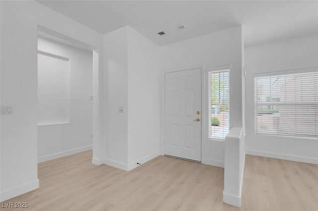 foyer with light hardwood / wood-style flooring