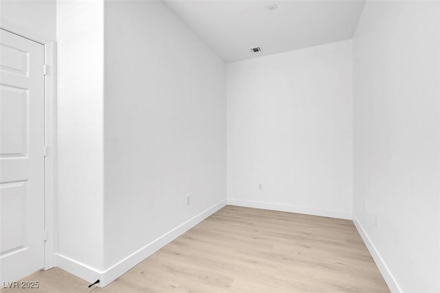 unfurnished room with light hardwood / wood-style flooring