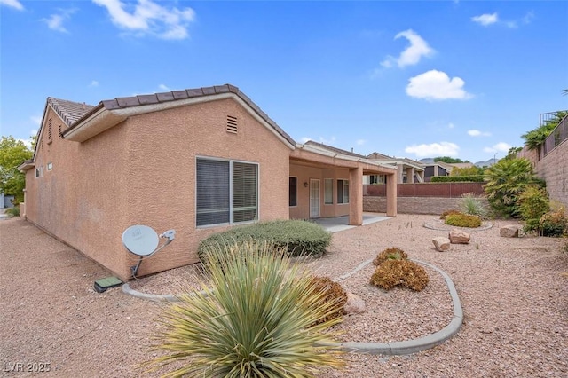 back of house featuring a patio