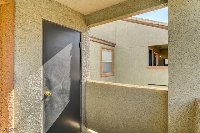 view of side of home with a balcony