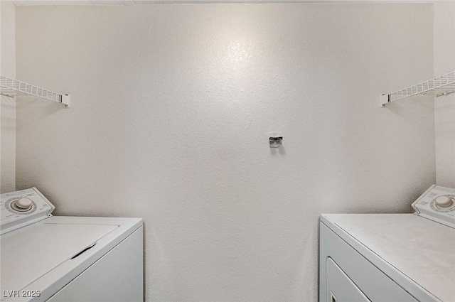 laundry area with washing machine and clothes dryer