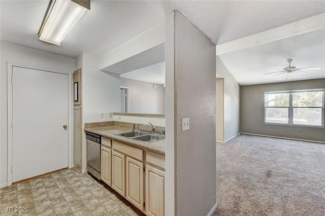 kitchen with sink, light carpet, a textured ceiling, stainless steel dishwasher, and ceiling fan