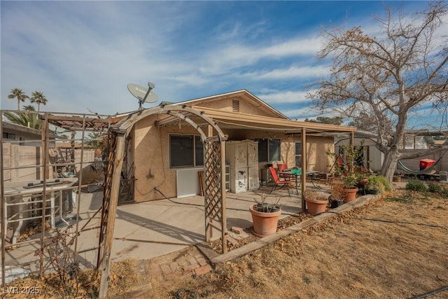 back of property featuring a patio area