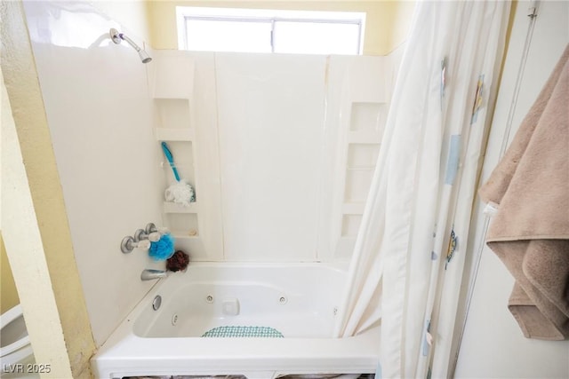 bathroom featuring shower / bath combo with shower curtain