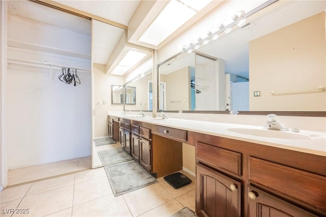 bathroom with tile patterned flooring and vanity